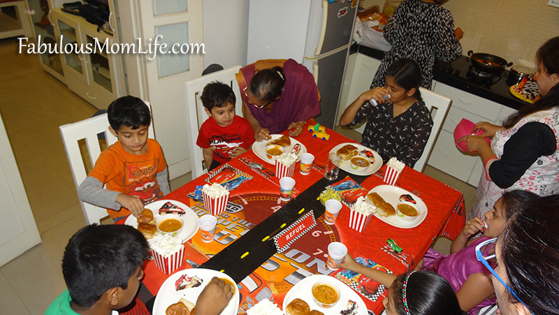 Kids enjoying food at the 'Refuel Station' - Cars Party Table Setting