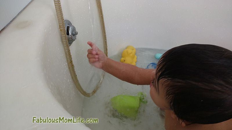 Baby's Bath Time Fun with Stream of Water
