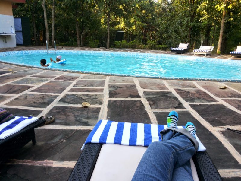 Relaxing by the poolside on my babymoon at Pench Tiger Reserve