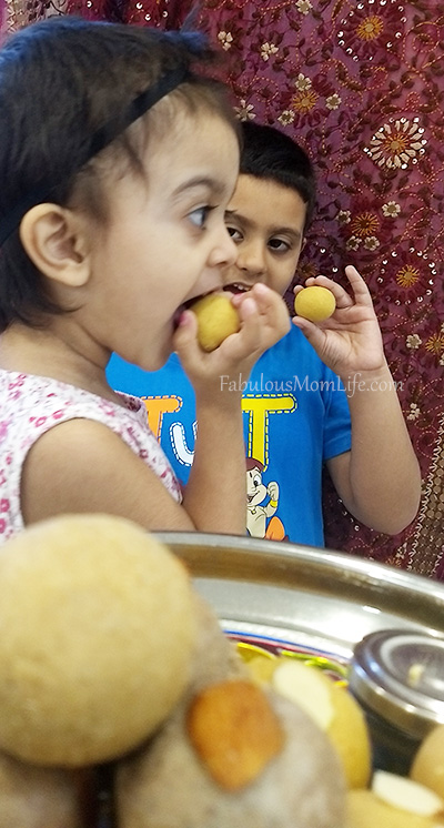 sam sim eating laddoos