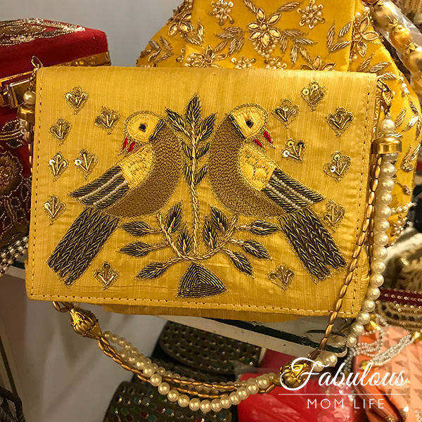 yellow embroidered bird indian clutch bag