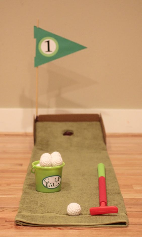DIY golf course using a Towel and a cardboard box