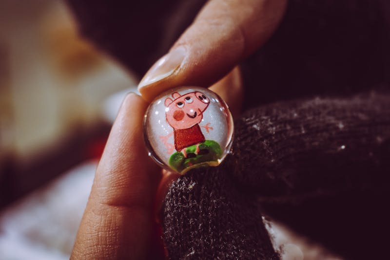 Photo by Chris F: https://www.pexels.com/photo/person-holding-peppa-pig-toy-marble-1677794/