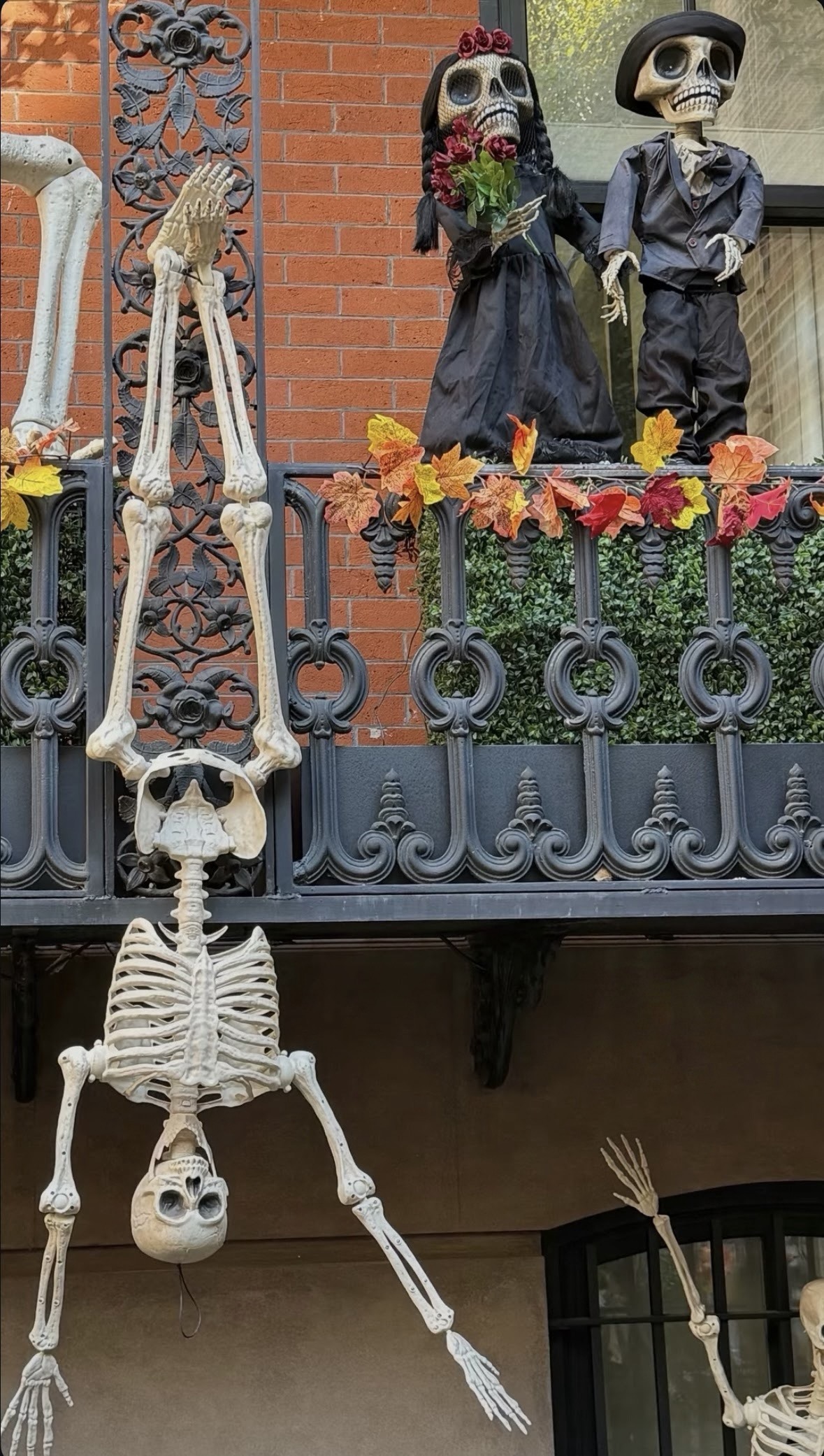 Skeleton couple on the balcony - NYC Halloween Decorations