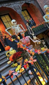 Giant skeleton, pumpkins and autumn leaves