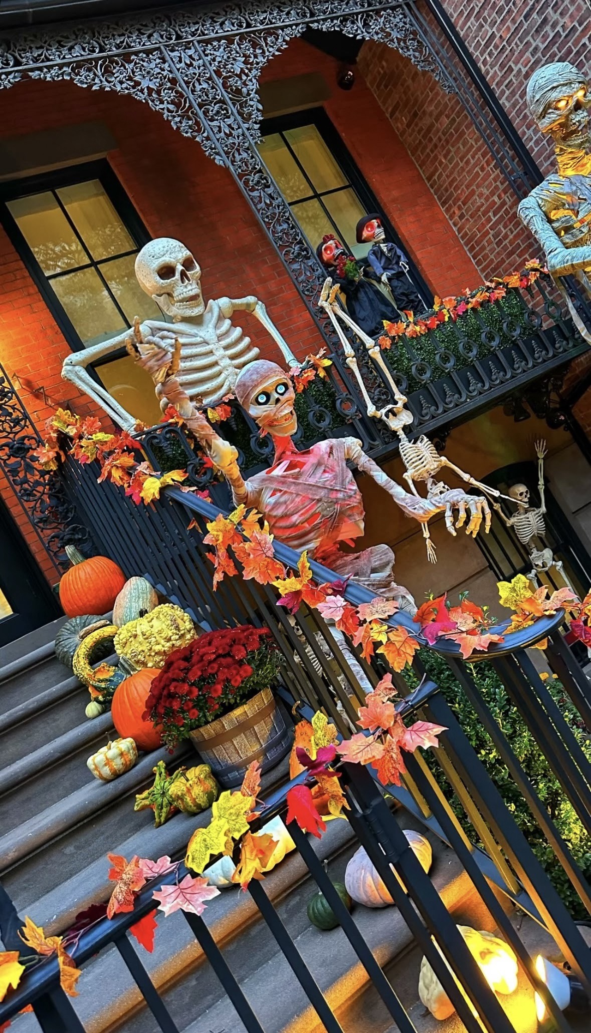 Giant skeleton, pumpkins and autumn leaves